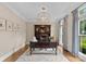 Home office with dark wood desk, hutch, crown molding, and large window at 1021 Westbury Dr, Matthews, NC 28104