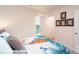 Cozy bedroom featuring a bed with dinosaur themed bedding and a view of the walk-in closet at 1033 20Th Avenue Se Loop, Hickory, NC 28602