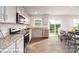 Open concept kitchen and dining area featuring granite countertops, stainless steel appliances, and ample cabinet space at 1033 20Th Avenue Se Loop, Hickory, NC 28602