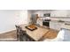 Open concept kitchen and dining area featuring granite countertops and stainless steel appliances at 1033 20Th Avenue Se Loop, Hickory, NC 28602