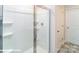 Clean shower features clear glass doors and built-in shelving at 1033 20Th Avenue Se Loop, Hickory, NC 28602