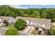 Lovely townhome community surrounded by mature trees and a tranquil pond for a peaceful setting at 104 Clydesdale Ct, Matthews, NC 28104