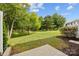 Beautiful view of backyard with pond and trees at 104 Clydesdale Ct, Matthews, NC 28104