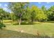 Backyard view of the pond, lawn and trees at 104 Clydesdale Ct, Matthews, NC 28104