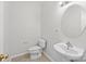 Modern half bathroom featuring a pedestal sink and minimalist design at 104 Clydesdale Ct, Matthews, NC 28104