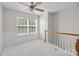 Bright bedroom with a ceiling fan and a window at 104 Clydesdale Ct, Matthews, NC 28104