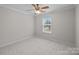Neutral bedroom features carpet, ceiling fan, crown molding and a window at 104 Clydesdale Ct, Matthews, NC 28104