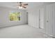 Spacious bedroom featuring a ceiling fan, a large window, and neutral colors at 104 Clydesdale Ct, Matthews, NC 28104