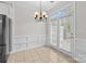 Bright breakfast area with a stylish chandelier and direct access to the outside patio at 104 Clydesdale Ct, Matthews, NC 28104