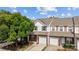 Charming townhome with brick accents, attached garage, and beautiful landscaping, ready for move in at 104 Clydesdale Ct, Matthews, NC 28104