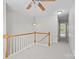 Hallway with white walls and wood railing at 104 Clydesdale Ct, Matthews, NC 28104