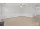 Bright and airy living room featuring ample empty space and access to other rooms at 104 Clydesdale Ct, Matthews, NC 28104
