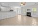 Spacious living room featuring tile floors and a cozy fireplace, perfect for gatherings at 104 Clydesdale Ct, Matthews, NC 28104