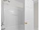 Bathroom features a shower over tub with white surround and a chrome shower head at 104 Clydesdale Ct, Matthews, NC 28104