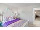 Cheerful bedroom featuring a white headboard, colorful pillows, and elephant artwork at 1045 20Th Avenue Se Loop, Hickory, NC 28602