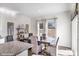 Bright dining area features hardwood floors, a large window, and an elegant table with seating for six at 1045 20Th Avenue Se Loop, Hickory, NC 28602