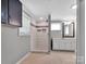 Bathroom with a tile shower, tiled floor, white vanity, and fresh paint at 105 Strickland Ln, Bessemer City, NC 28016