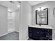 Bathroom featuring new vanity with solid surface countertop and tiled shower at 105 Strickland Ln, Bessemer City, NC 28016