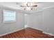 Well lit bedroom featuring hardwood floors, fresh paint, and a window allowing natural light at 105 Strickland Ln, Bessemer City, NC 28016