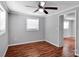 Standard bedroom featuring hardwood floors, fresh paint, and a window allowing natural light at 105 Strickland Ln, Bessemer City, NC 28016