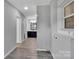 Hallway leading to a bathroom featuring fresh paint and easy access to all rooms at 105 Strickland Ln, Bessemer City, NC 28016