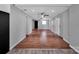 Large living room featuring hardwood floors, ample lighting, and access to other rooms at 105 Strickland Ln, Bessemer City, NC 28016