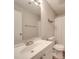 Neutral bathroom with white vanity, framed mirror, and shower with curtain at 1052 Churchill Downs Ct # I, Charlotte, NC 28211