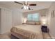 Bedroom featuring a large bed, ceiling fan, and natural light from window at 1052 Churchill Downs Ct # I, Charlotte, NC 28211