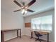 Bright bedroom with two desk areas, fan and natural light from window at 1052 Churchill Downs Ct # I, Charlotte, NC 28211