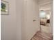 Hallway leading to carpeted bedroom featuring double closets and ceiling fan at 1052 Churchill Downs Ct # I, Charlotte, NC 28211