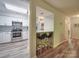 Eat-in kitchen with stainless steel appliances, granite counters, and bar seating area at 1052 Churchill Downs Ct # I, Charlotte, NC 28211