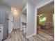 Efficient kitchen layout next to a laundry area and a view of the living room with a balcony at 1052 Churchill Downs Ct # I, Charlotte, NC 28211
