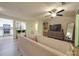 Inviting living room with modern furnishings, a ceiling fan, and natural light at 1052 Churchill Downs Ct # I, Charlotte, NC 28211