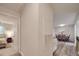 View of the living room with a dining area and a bedroom in the background at 1052 Churchill Downs Ct # I, Charlotte, NC 28211