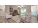 Bright living room with a sliding glass door leading to a balcony, and modern decor at 1052 Churchill Downs Ct # I, Charlotte, NC 28211
