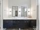 Contemporary bathroom featuring a double vanity with sleek mirrors and modern lighting at 1054 Kenilworth Ave, Charlotte, NC 28204