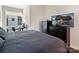 Cozy bedroom with a large TV, dresser, and a serene atmosphere at 1054 Kenilworth Ave, Charlotte, NC 28204