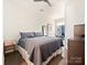 Bedroom featuring neutral tones and hardwood floors, with a work desk area at 1054 Kenilworth Ave, Charlotte, NC 28204
