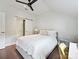 Serene bedroom featuring a comfortable bed, and a sliding barn door for closet access at 1054 Kenilworth Ave, Charlotte, NC 28204