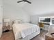 Bright and airy bedroom with a neutral palette, a vaulted ceiling, and a dedicated workspace at 1054 Kenilworth Ave, Charlotte, NC 28204