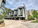 Street view of townhomes showcasing modern architectural design and convenient attached garages at 1054 Kenilworth Ave, Charlotte, NC 28204