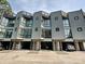 Modern townhome row showcasing unique architectural design and convenient attached garages at 1054 Kenilworth Ave, Charlotte, NC 28204