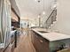 Open kitchen with stainless appliances, kitchen island, and views to the living room and dining area at 1054 Kenilworth Ave, Charlotte, NC 28204