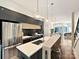 Modern kitchen with stainless steel appliances, breakfast bar, and pendant lighting at 1054 Kenilworth Ave, Charlotte, NC 28204
