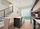 Contemporary kitchen featuring an island with bar seating and modern design elements at 1054 Kenilworth Ave, Charlotte, NC 28204