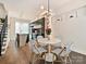 Modern kitchen with stainless steel appliances and sleek cabinetry; open to the dining area at 1054 Kenilworth Ave, Charlotte, NC 28204