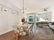 Open-concept living and dining area with hardwood floors and plenty of natural light at 1054 Kenilworth Ave, Charlotte, NC 28204