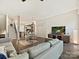 Open-concept living room with hardwood floors seamlessly connecting to kitchen and dining area at 1054 Kenilworth Ave, Charlotte, NC 28204