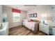 Cozy bedroom featuring a comfortable bed, dresser, and a bright window at 1064 20Th Avenue Se Loop, Hickory, NC 28602