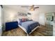 Cozy bedroom with a ceiling fan, natural light and ample closet space at 1064 20Th Avenue Se Loop, Hickory, NC 28602